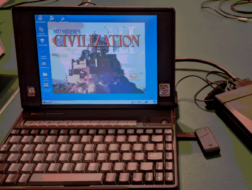 The HP OmniBook 800CT on a table with Civilization loaded up on it. 